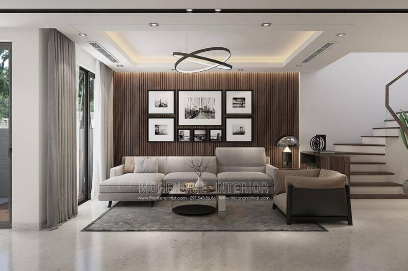 Trang trí tường phòng khách đẹp độc đáo với gỗ ốp tường kết hợp tranh đen trắng canvas. Thiết kế biệt thự